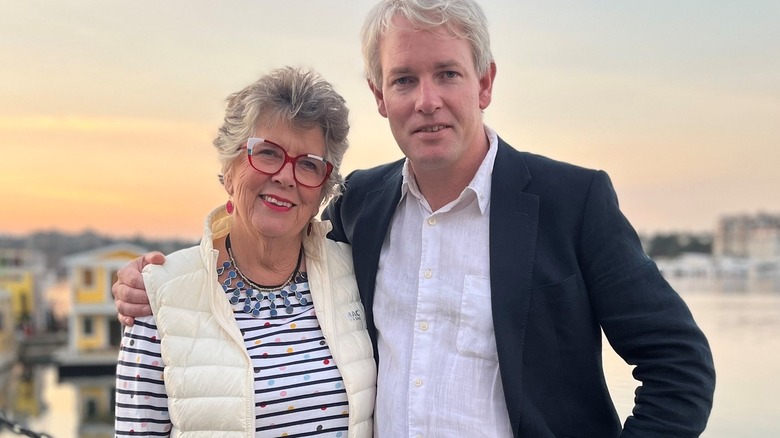 Prue Leith and son Danny Kruger pose waterside