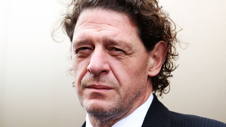 Marco Pierre White in dark suit