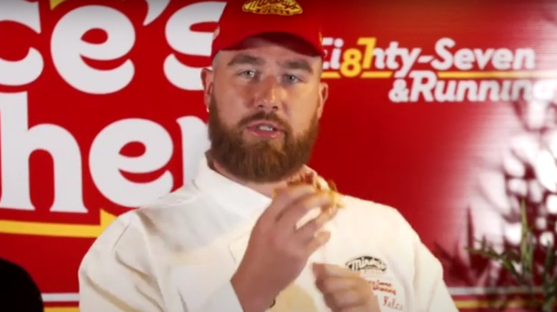 Travis Kelce stretches dough