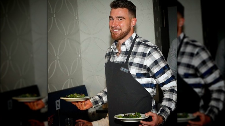 Travis Kelce with salad plates