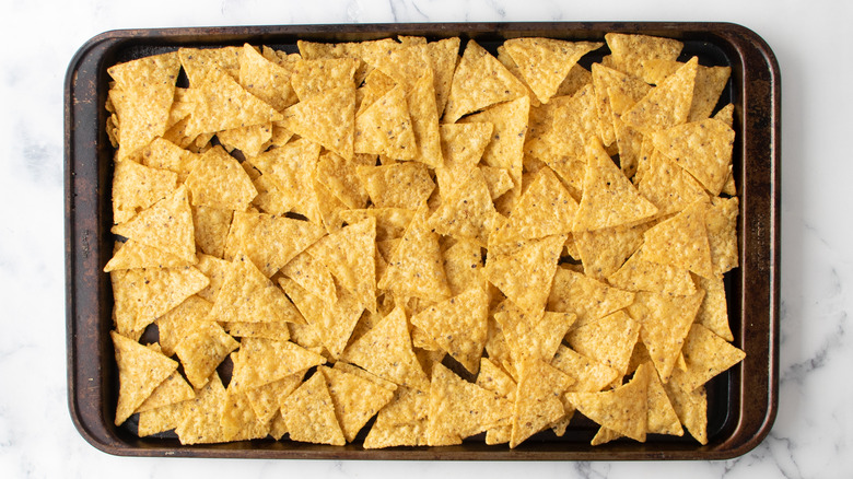 tortilla chips on baking sheet