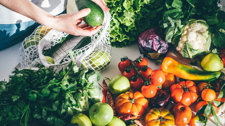 person unpacking produce