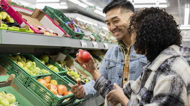 people shopping for produce