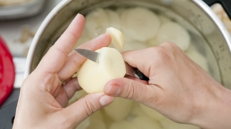 sliced potatoes in water