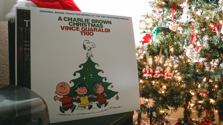 Record of A Charlie Brown Christmas next to tree