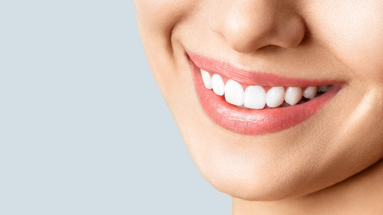 Closeup of woman smiling with teeth showing