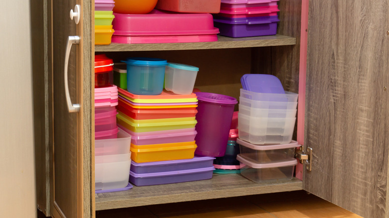 Cabinet full of plastic containers