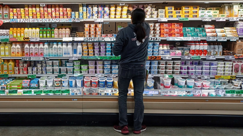 Person inspecting Trader Joe's yogurt