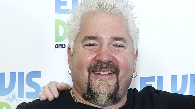 Guy Fieri closeup with hand on shoulder