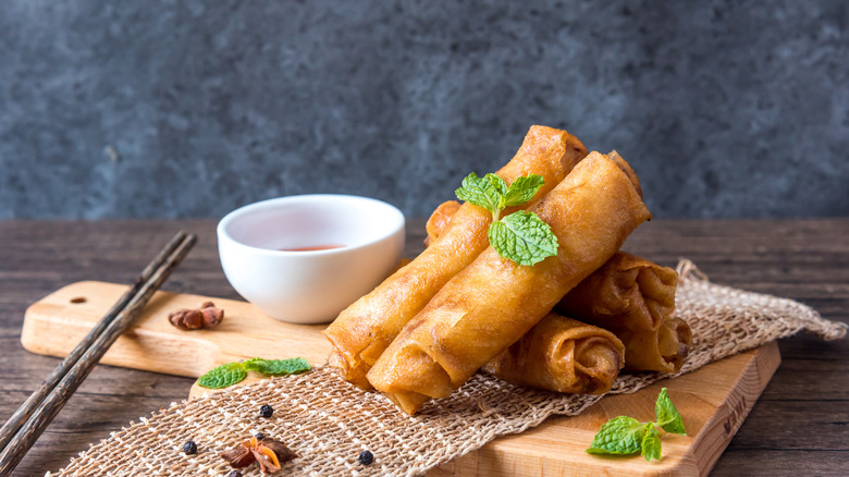 Egg rolls on wooden board