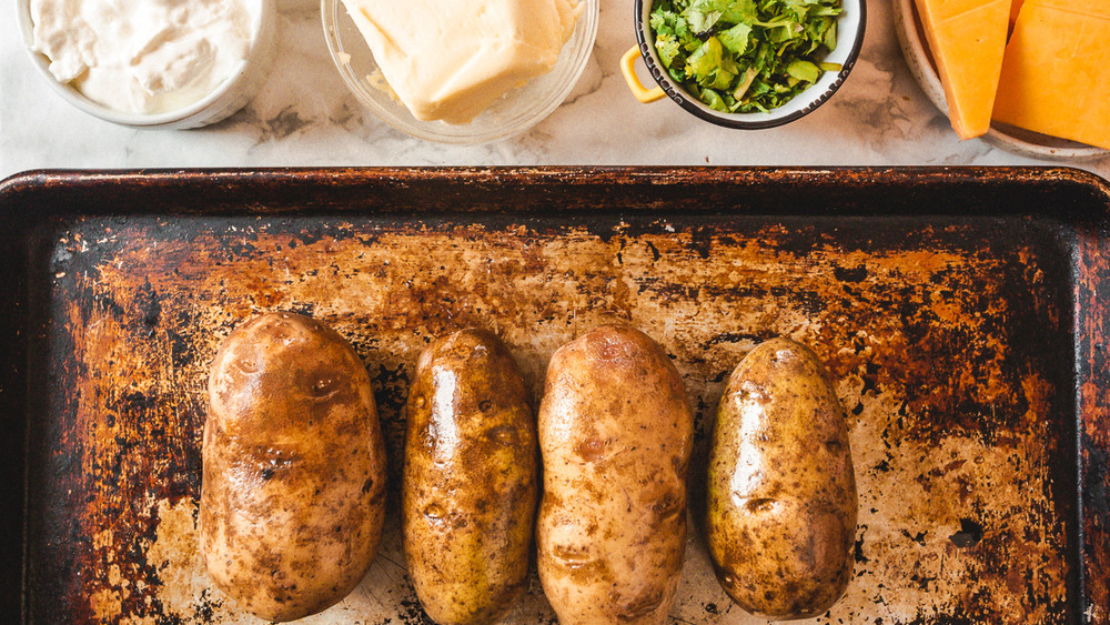 twice baked potatoes on baking sheet