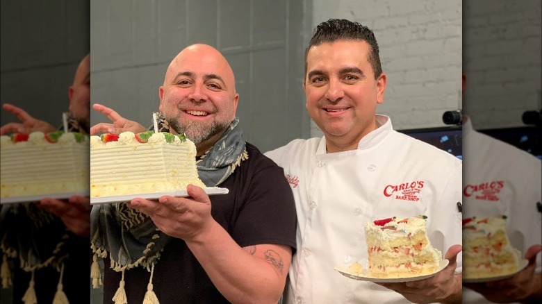 Duff Goldman and Buddy Valastro holding cakes