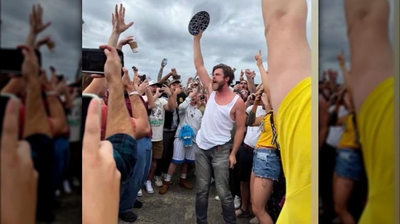 Fans cheer as man finishes rotisserie chicken