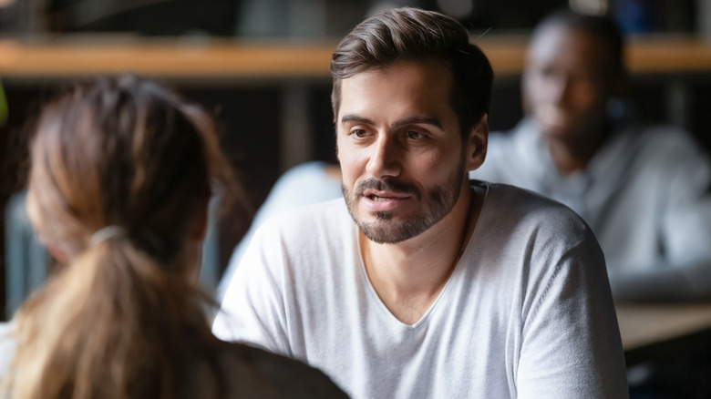 man talking to a woman