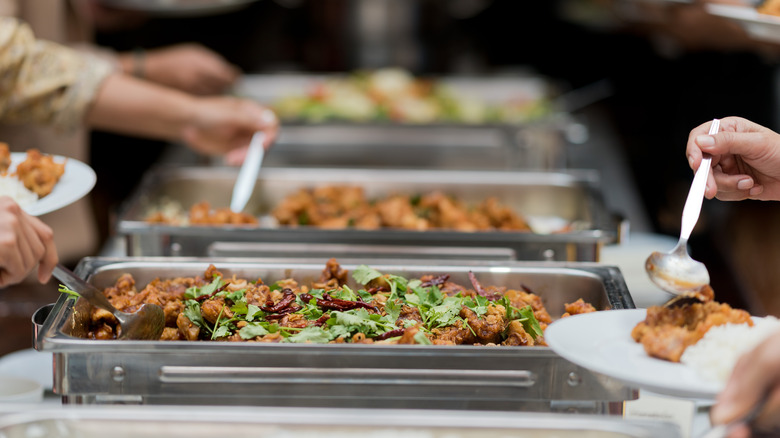 People helping themselves from buffet