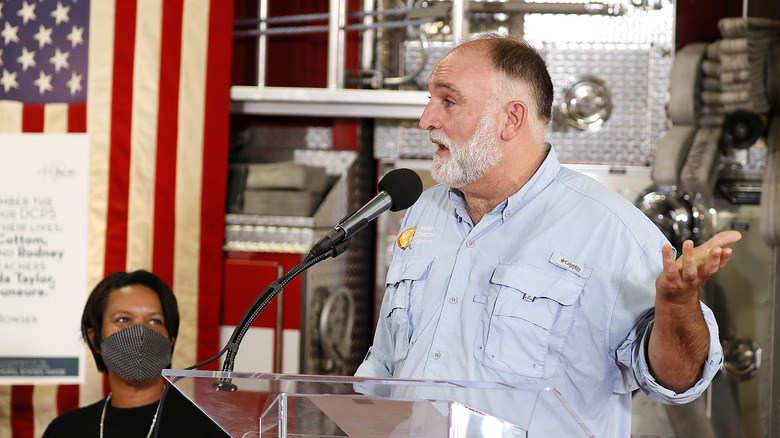 José Andrés speaking near US flag