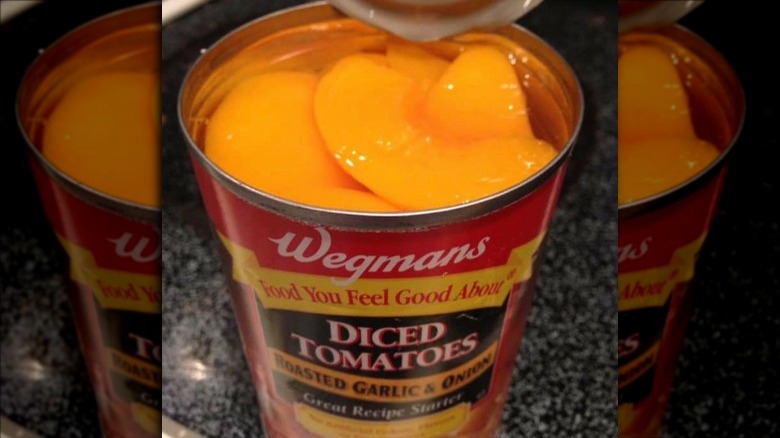 Can of Wegman's tomato showing sliced peaches