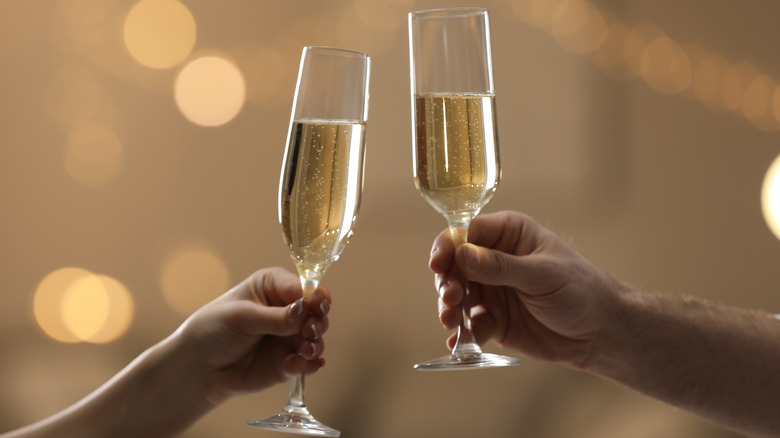 two toasting champagne flutes 