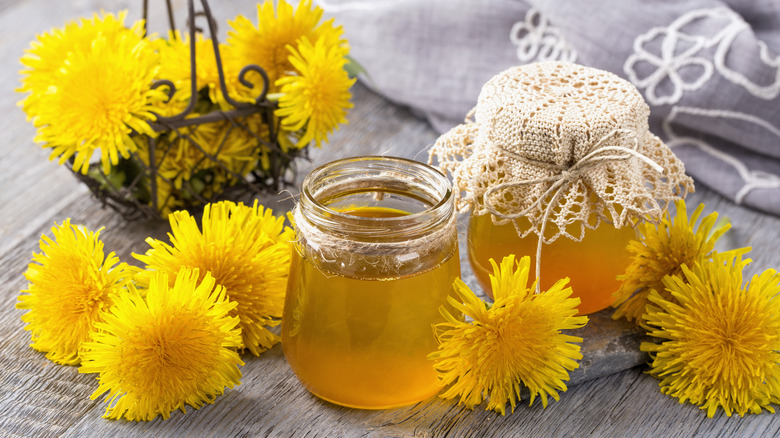 jars of manmade dandelion honey