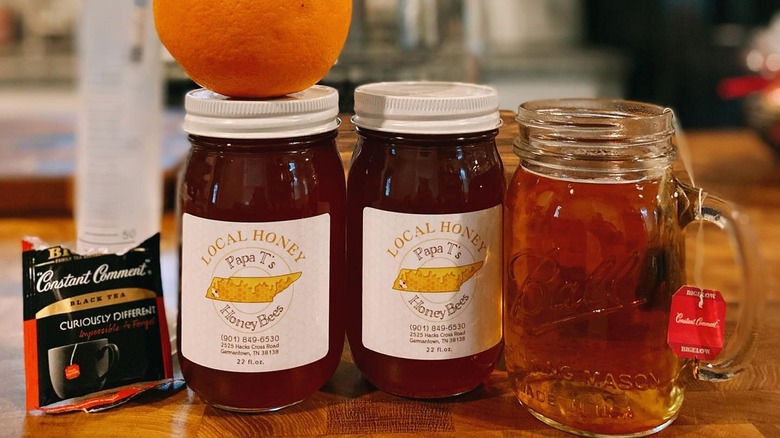 jars of orange blossom honey and glass of mead