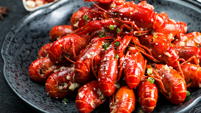 Chinese crawfish in black ceramic dish