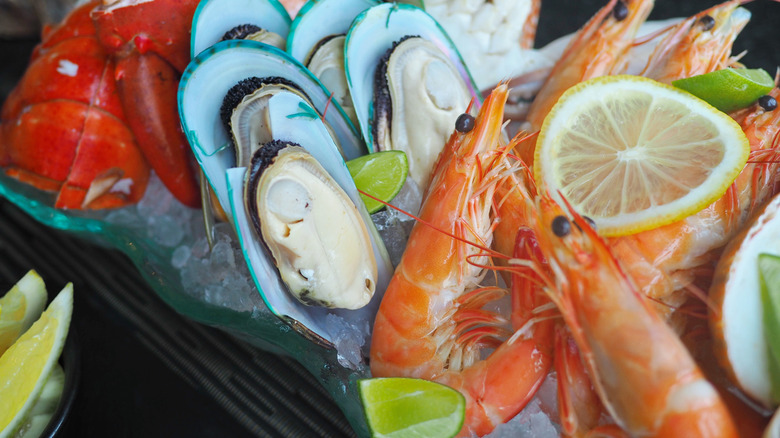 Mixed seafood assortment with scampi, oysters, and lobster