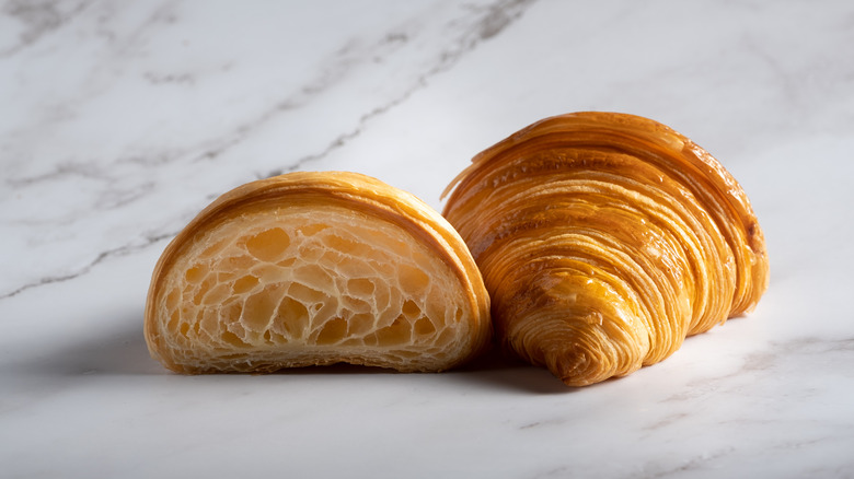 Croissant on marble backdrop