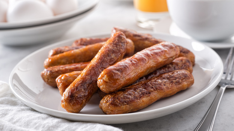 Breakfast sausage on white plate 