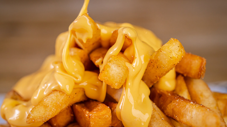 Melted cheese poured over fries