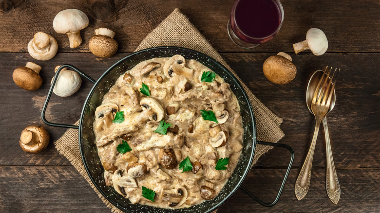 mushroom dish with red wine glass