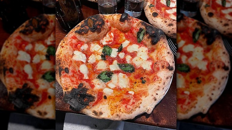 Wood-fired pizza on table