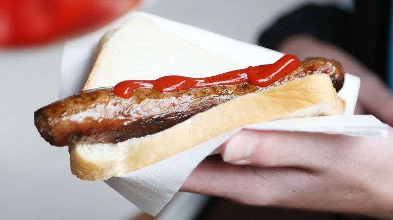 sausage in bun with ketchup