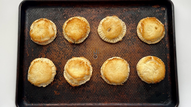 toasted circular sandwiches in a baking pan