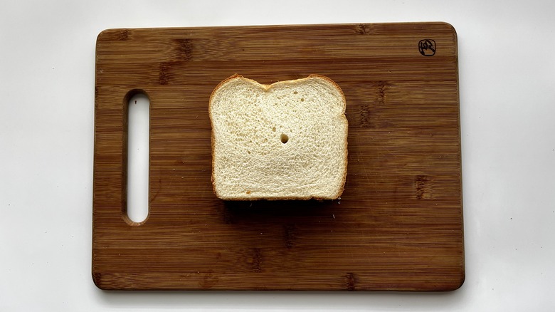 white bread sandwich on a wooden board