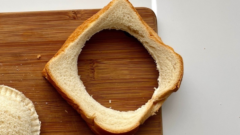 slice of white bread with a circular hole in the middle