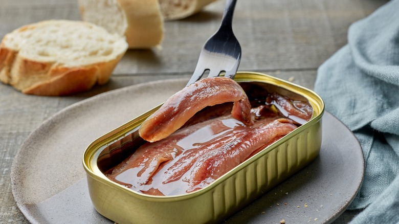 Anchovy tin on plate