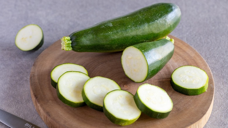 sliced zucchini on cutting board