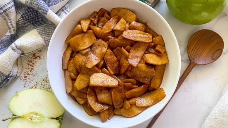 Fried apples in white bowl
