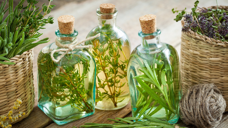 Corked bottles with herbs and twine