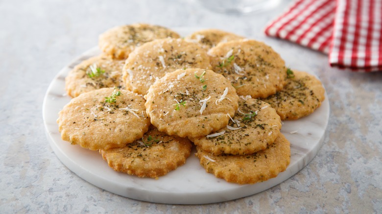 Cheesy crackers on a marble display stand