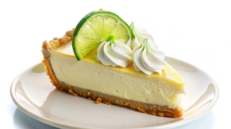 Slice of key Lime pie on a white plate