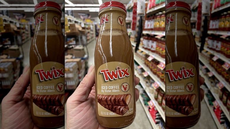 hand holding Twix bottled iced coffee