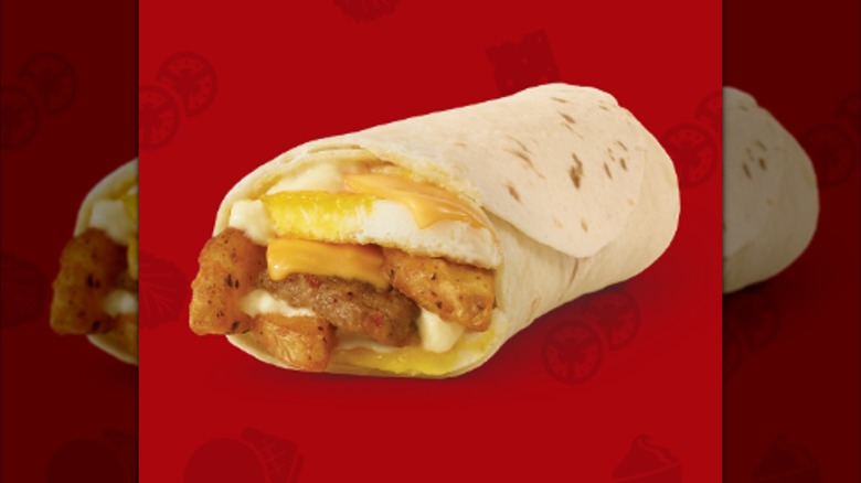 The sausage burrito from Wendy's is on a red background.