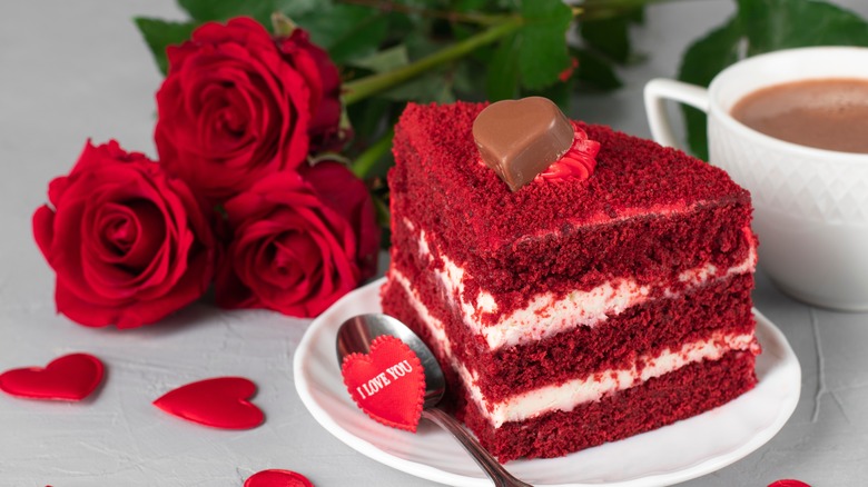 red layered cake with roses