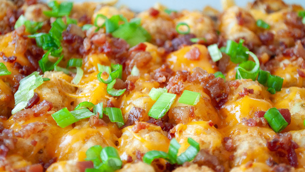 tater tot casserole closeup with green onion