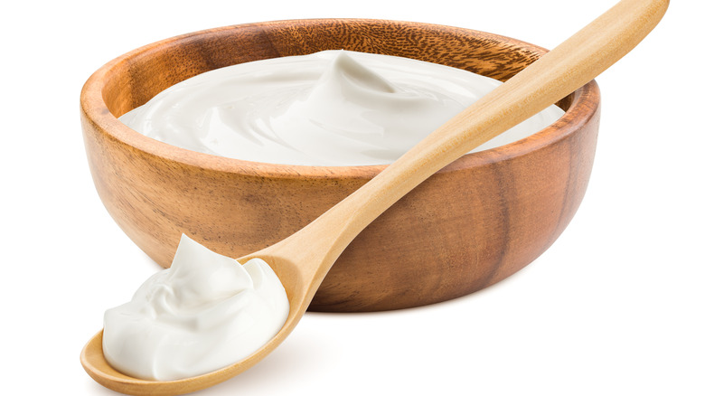 fromage blanc in wooden bowl with spoon