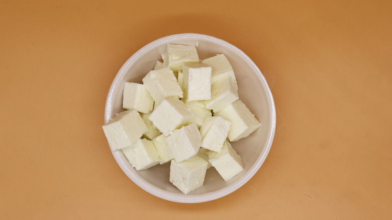 cubed paneer cheese in white bowl