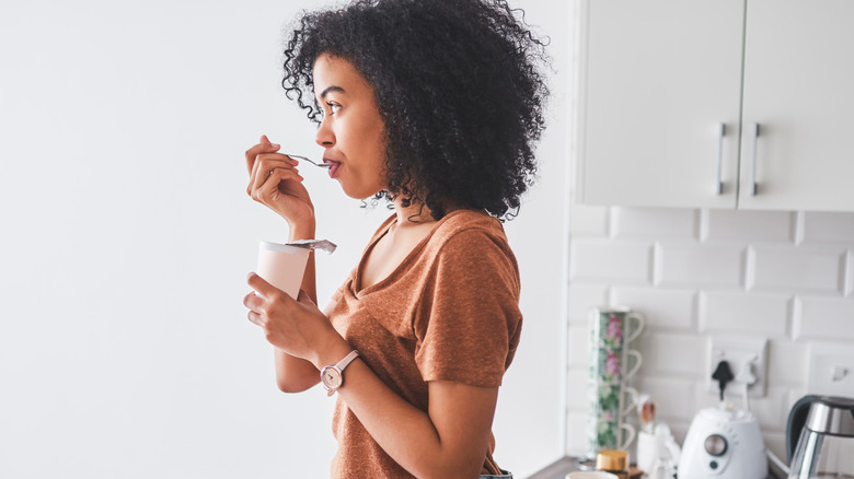 woman eating yogurt