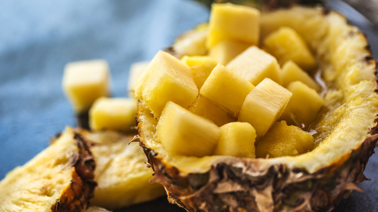 chopped pineapple in halved pineapple shell