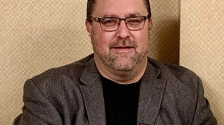 David Ruggerio with glasses and blazer